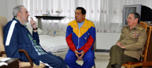 President Chavez in hospital with Cuban counterpart Raul Castro, and Fidel Castro (Reuters)