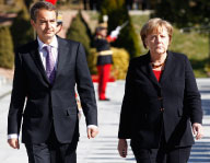 Spain's PM Zapatero (L) and German Chancellor Merkel in Madrid  (Reuters/Juan Medina)