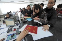 People pay tax at the local taxation bureau in Hefei, in China's  Anhui province(Reuters)