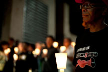 Activists and supporters of the Right 2 Know campaign hold a night vigil outside the Constitutional Court in Johannesburg.(Reuters)