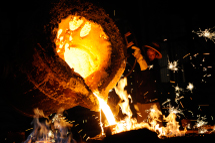 A labourer pours molten iron into a cast at a factory in Yingtan, China(Reuters)