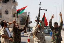 Anti-Qadhafi fighters celebrate the fall of Muammar al-Qadhafi in  Sirte.(REUTERS/Saad Shalash)
