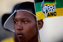 A youth is adorned with flags of the ruling African National Congress  (ANC) during an election campaign event in Cape Town.(REUTERS/Mike Hutchings) 