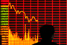 An investor is seen in front of an electronic board showing stock information.(REUTERS)