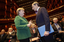 German Chancellor Merkel talks to new European Central Bank President Draghi.(REUTERS\Kai Pfaffenbach)