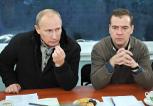 Prime Minister Putin gestures as President Medvedev looks on during a meeting with with workersin the Stavropol region, Russia.(REUTERS/RIA Novosti)