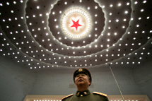 A military delegate stands inside the Great Hall of the People in  Beijing.(REUTERS/Jason Lee)
