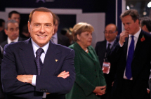 Italy's Prime Minister Silvio Berlusconi looks on during the G20  Summit of major world economies in Cannes. (REUTERS/Kevin Lamarque)