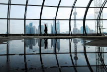 A worker walks inside the incomplete Shanghai International Passenger Transport Center. (REUTERS)