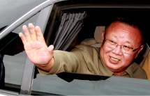 North Korean leader Kim Jong-il waves from his car.(REUTERS/RIA Novosti)