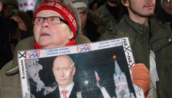 People attend a protest rally in Moscow. (REUTERS/Anton Golubev)