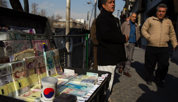 A Middle Eastern money changer waits for customers. (REUTERS/Raheb Homavandi)