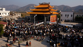 Residents of Wukan village listen to town representatives speak. (REUTERS/David Gray)