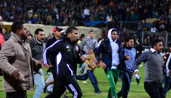 Fans try to leave the soccer stadium in Port Said city, Egypt. (REUTERS/Stringer)