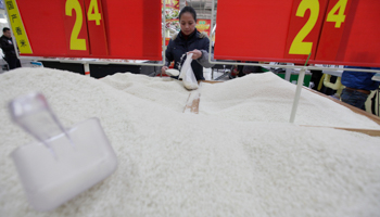 A customer shops for rice at a supermarket in China. (REUTERS/Darley Shen)