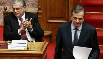 Greek Prime Minister Lucas Papademos and conservative party leader Antonis Samaras. (REUTERS/John Kolesidis)