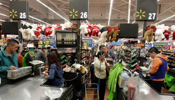 People stand in the check-out lines at a Wal-Mart store in Mexico City. (REUTERS/Henry Romero)