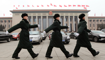 Soldiers march in front of the Great Hall of the People in Beijing. (REUTERS/Jason Lee)