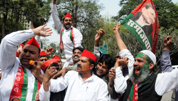 Supporters of the Samajwadi Party celebrate in New Delhi. (REUTERS/Stringer India)