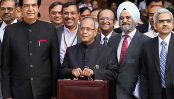 Finance Minister Pranab Mukherjee leaving his office to present the budget. (REUTERS/Vijay Mathur)