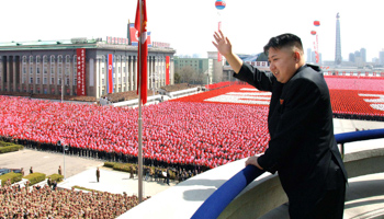 Kim Jong-un waves during a military parade marking the centenary of Kim Il-sung. (REUTERS/KCNA KCNA)