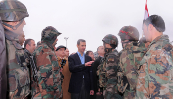 President Assad speaks to soldiers in Homs. (REUTERS/Sana Sana)