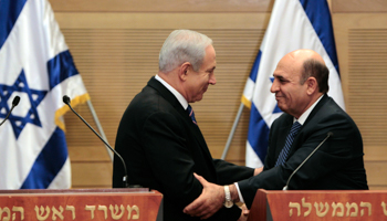 Prime Minister Binyamin Netanyahu and new Deputy Prime Minister Shaul Mofaz. (REUTERS/Ammar Awad)