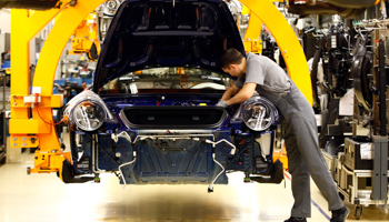 A worker assembles a car at the Porsche factory in Stuttgart-Zuffenhausen, Germany. (REUTERS/Michael Dalder)