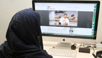 A Saudi woman watches an online video. (REUTERS/Stringer)