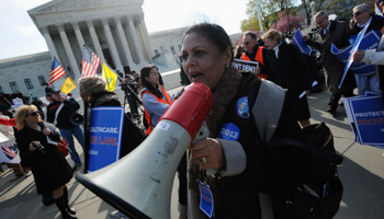 Supporters of the Affordable Care Act rally outside the Supreme Court in Washington. (REUTERS/Jonathan Ernst)