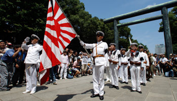 Men dressed as Japanese imperial army soldiers pay tribute to the war dead at Yasukuni Shrine. (REUTERS/Issei Kato)