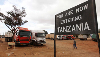 Trucks wait at the Kenyan/Tanzanian border crossing point in Namanga. (REUTERS/Noor Khamis)