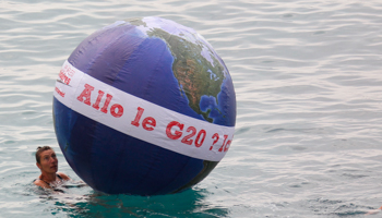 An anti-G20 demonstrator takes part in a protest against globalisation in Nice. (REUTERS/Vincent Kessler)