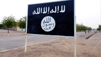 The flag of the Ansar al-Din Islamist group is posted on a road sign in Kidal (REUTERS/Stringer)