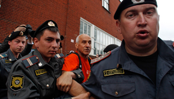 Police detain an activist during a protest demanding the release of political prisoners in Moscow (REUTERS/Maxim Shemetov)