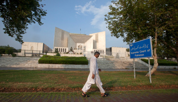 A man walks past the Supreme Court building in Islamabad (REUTERS/Faisal Mahmood)