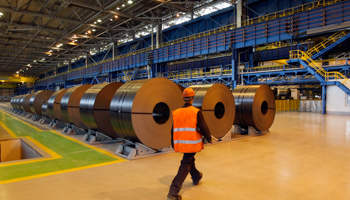 An employee walks inside a new cold rolling mill at Magnitogorsk Iron and Steel Works (REUTERS/Sergei Karpukhin)