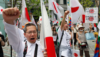 Anti-China protesters shout slogans during a rally in Tokyo (REUTERS/Kim Kyung Hoon)