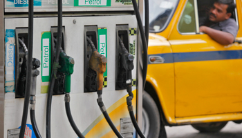 A taxi driver waits at a fuel station in Kolkata (REUTERS/Rupak De Chowdhuri)