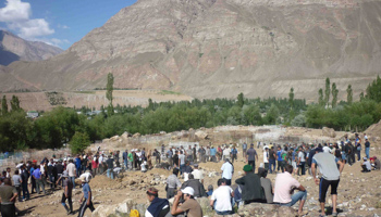 People bury victims of fighting in the Gorno-Badakhshan (REUTERS/Handout)