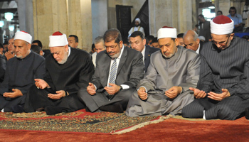 Egypt's President Morsi attends prayers at al-Azhar mosque in Cairo (REUTERS/Handout)