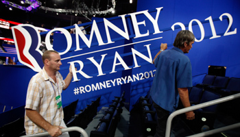 Workers carry a Romney-Ryan sign at the Republican National Convention in Tampa (REUTERS/Mike Segar)