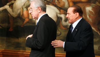 Prime Minister Mario Monti and his predecessor Silvio Berlusconi(REUTERS/Tony Gentile)