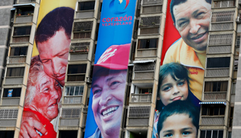 Banners of Venezuelan President Hugo Chavez hang from an apartment building in Caracas (REUTERS/Jorge Silva)