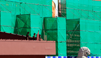 Workers repair the reviewing stand at the Tiananmen Gate in Beijing (REUTERS/Jason Lee)