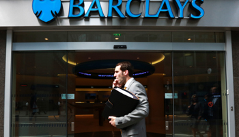 A man walks past a branch of Barclays Bank in London (REUTERS/Olivia Harris)