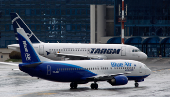 Boeing and Airbus planes at Henri Coanda Airport near Bucharest (REUTERS/Bogdan Cristel)