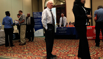 People wait in line at a job fair in New York (REUTERS/Shannon Stapleton)