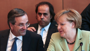 German Chancellor Merkel talks to Greek Prime Minister Samaras during a meeting in Athens (REUTERS/Stringer)