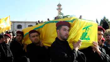 Hezbollah members in Baalbek carry the coffin of a man killed in the Syrian conflict (REUTERS/Stringer)